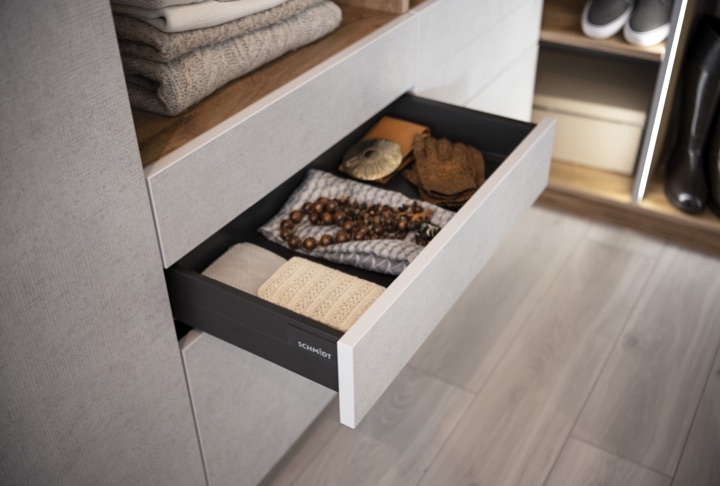 Warm minimalist storage drawer in a Schmidt kitchen